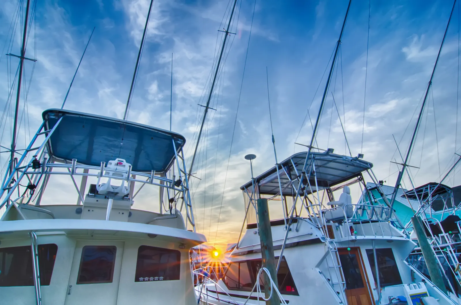 Sportfishing boats in a marina at sunrise